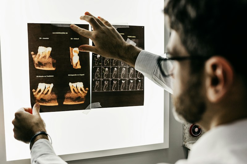 Dentist examining patient in Lockport NY